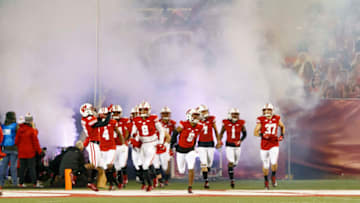 Oct 23, 2020; Madison, Wisconsin, USA; The Wisconsin Badgers run onto the field prior to the game against the Illinois Fighting Illini at Camp Randall Stadium. Mandatory Credit: Jeff Hanisch-USA TODAY Sports