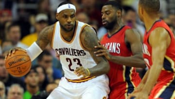 Nov 10, 2014; Cleveland, OH, USA; Cleveland Cavaliers forward LeBron James (23) drives against New Orleans Pelicans forward Tyreke Evans (1) during the fourth quarter at Quicken Loans Arena. The Cavaliers beat the Pelicans 118-111. Mandatory Credit: Ken Blaze-USA TODAY Sports
