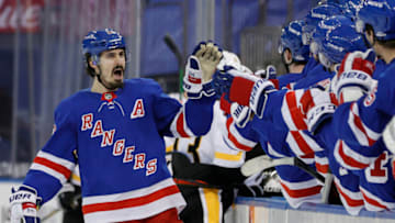 NEW YORK, NEW YORK - FEBRUARY 01: Chris Kreider #20 of the New York Rangers celebrates with teammates after scoring a goal during the third period against the Pittsburgh Penguins at Madison Square Garden on February 01, 2021 in New York City. The Rangers won 3-1. (Photo by Sarah Stier/Getty Images)
