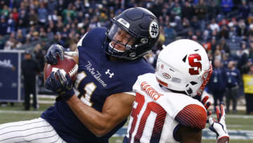 NEW YORK, NY - NOVEMBER 17: Alohi Gilman #11 of the Notre Dame Fighting Irish pulls in a pass intended for Taj Harris #80 of the Syracuse Orange during their game at Yankee Stadium on November 17, 2018 in New York, New York. (Photo by Jeff Zelevansky/Getty Images)