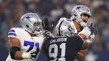 La'el Collins #71 of the Dallas Cowboys tries to protect Dak Prescott #4 of the Dallas Cowboys (Photo by Tom Pennington/Getty Images)
