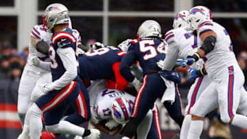 FOXBOROUGH, MASSACHUSETTS - DECEMBER 26: Matt Judon #9 of the New England Patriots tackles Josh Allen #17 of the Buffalo Bills during the second quarter at Gillette Stadium on December 26, 2021 in Foxborough, Massachusetts. (Photo by Omar Rawlings/Getty Images)