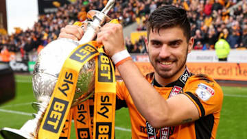 WOLVERHAMPTON, ENGLAND - APRIL 28: Ruben Neves of Wolverhampton Wanderers lifts the Sky Bet Championship trophy during the Sky Bet Championship match between Wolverhampton Wanderers and Sheffield Wednesday at Molineux on April 28, 2018 in Wolverhampton, England. (Photo by Robbie Jay Barratt - AMA/Getty Images)