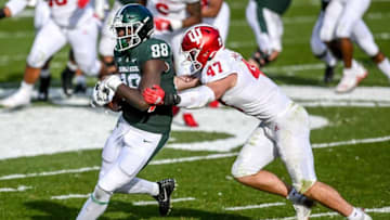 Michigan State's Trenton Gillison, left, catches a pass as Indiana's Micah McFadden closes in during the third quarter on Saturday, Nov. 14, 2020, at Spartan Stadium in East Lansing.201114 Msu Indiana 174a