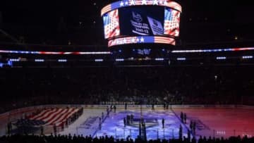 Jun 7, 2014; Los Angeles, CA, USA; A general view as a large American flag is unfurled on the ice during the playing of the national anthem before game two of the 2014 Stanley Cup Final between the New York Rangers and the Los Angeles Kings at Staples Center. Mandatory Credit: Richard Mackson-USA TODAY Sports
