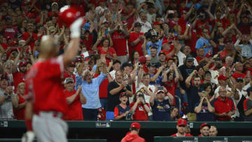 Jun 23, 2019; St. Louis, MO, USA; Los Angeles Angels first baseman Albert Pujols (5) salutes the fans as he receives a standing ovation during the ninth inning against the St. Louis Cardinals at Busch Stadium. Mandatory Credit: Jeff Curry-USA TODAY Sports