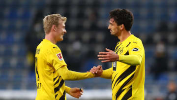 BIELEFELD, GERMANY - OCTOBER 31: Mats Hummels of Borussia Dortmund celebrates with teammate Julian Brandt after he scores his team's second goal during the Bundesliga match between DSC Arminia Bielefeld and Borussia Dortmund at Schueco Arena on October 31, 2020 in Bielefeld, Germany. Sporting stadiums around Germany remain under strict restrictions due to the Coronavirus Pandemic as Government social distancing laws prohibit fans inside venues resulting in games being played behind closed doors. (Photo by Martin Rose/Getty Images)