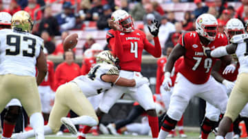 LOUISVILLE, KY - OCTOBER 27: Jawon Pass #4 of the Louisville Cardinals fumbles the ball as he is hit by Demetrius Kemp #34 of the Wake Forest Demon Deacons on October 27, 2018 in Louisville, Kentucky. (Photo by Andy Lyons/Getty Images)