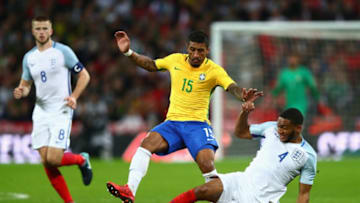 LONDON, ENGLAND - NOVEMBER 14: Paulinho of Brazil and Joe Gomez of England battle for possession during the international friendly match between England and Brazil at Wembley Stadium on November 14, 2017 in London, England. (Photo by Clive Rose/Getty Images)