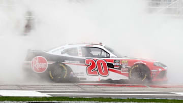 HAMPTON, GA - FEBRUARY 23: Christopher Bell, driver of the #20 Rheem Toyota, celebrates with a burnout after winning the NASCAR Xfinity Series Rinnai 250 at Atlanta Motor Speedway on February 23, 2019 in Hampton, Georgia. (Photo by Brian Lawdermilk/Getty Images)