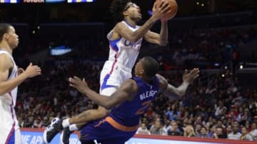 Oct 22, 2014; Los Angeles, CA, USA; Los Angeles Clippers guard Chris Douglas-Roberts (14) drives to the basket over Phoenix Suns guard Eric Bledsoe (2) during the second half at Staples Center. Mandatory Credit: Richard Mackson-USA TODAY Sports