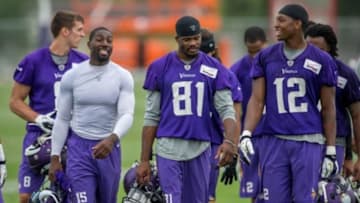 Jul 25, 2014; Mankato, MN, USA; Minnesota Vikings wide receiver Greg Jennings (15) and wide receiver Jerome Simpson (81) and wide receiver Kamar Jorden (12) leave the field at training camp at Minnesota State University. Mandatory Credit: Bruce Kluckhohn-USA TODAY Sports