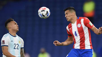 Paraguay and West Ham's Fabian Balbuena (R) in World Cup qualifying football against Argentina. (Photo by MARCELO ENDELLI/POOL/AFP via Getty Images)