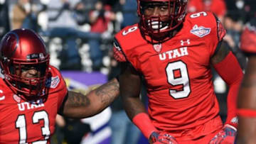 Dec 19, 2015; Las Vegas, NV, USA; Utah Utes defensive back Tevin Carter (9) celebrates with linebacker Gionni Paul (13) after scoring on a 28-yard interception return against the Brigham Young Cougars in the Las Vegas Bowl at Sam Boyd Stadium. Mandatory Credit: Kirby Lee-USA TODAY Sports