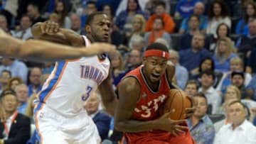 Nov 4, 2015; Oklahoma City, OK, USA; Toronto Raptors forward Terrence Ross (31) drives to the basket against Oklahoma City Thunder guard Dion Waiters (3) during the second quarter at Chesapeake Energy Arena. Mandatory Credit: Mark D. Smith-USA TODAY Sports