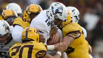 MINNEAPOLIS, MN - NOVEMBER 19: Clayton Thorson No. 18 of the Northwestern Wildcats is sacked by the Minnesota Golden Gophers during the second quarter of the game on November 19, 2016 at TCF Bank Stadium in Minneapolis, Minnesota. The Gophers defeated the Wildcats 29-12. (Photo by Hannah Foslien/Getty Images)