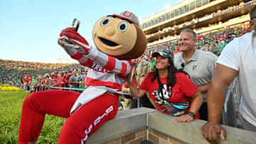 Sep 23, 2023; South Bend, Indiana, USA; Brutus Buckeye takes a selfie with Ohio State fans before the game between the Ohio State Buckeyes and the Notre Dame Fighting Irish at Notre Dame Stadium. Mandatory Credit: Matt Cashore-USA TODAY Sports