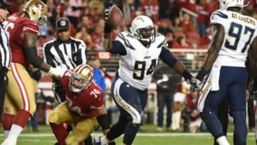 December 20, 2014; Santa Clara, CA, USA; San Diego Chargers defensive end Corey Liuget (94) scores a touchdown against San Francisco 49ers tackle Joe Staley (74) during the third quarter at Levi