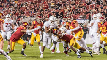 SANTA CLARA, CA - DECEMBER 01: Stanford Cardinal running back Bryce Love (20) breaks through the USC Trojans line and heads toward the end zone during the PAC-12 Championship game between the USC Trojans and the Stanford Cardinals on Friday, December 01, 2017 at Levi's Stadium in Santa Clara, CA. (Photo by Douglas Stringer/Icon Sportswire via Getty Images)