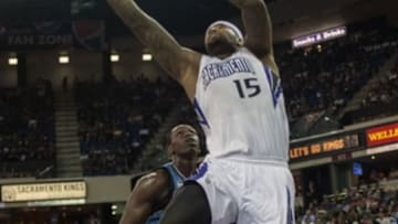Apr 13, 2014; Sacramento, CA, USA; Sacramento Kings center DeMarcus Cousins (15) goes to the basket against Minnesota Timberwolves center Gorgui Dieng (5) during the third quarter at Sleep Train Arena. The Sacramento Kings defeated the Minnesota Timberwolves 106-103. Mandatory Credit: Ed Szczepanski-USA TODAY Sports