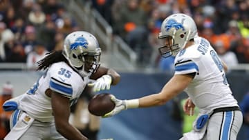 Jan 3, 2016; Chicago, IL, USA; Detroit Lions quarterback Matthew Stafford (9) hands off the football to Detroit Lions running back Joique Bell (35) against the Chicago Bears during the first half at Soldier Field. Mandatory Credit: Kamil Krzaczynski-USA TODAY Sports