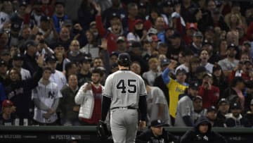 Oct 5, 2021; Boston, Massachusetts, USA; New York Yankees starting pitcher Gerrit Cole (45) walks to the dugout after being pulled against the Boston Red Sox during the third inning of the American League Wildcard game at Fenway Park. Mandatory Credit: Bob DeChiara-USA TODAY Sports