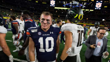 Auburn football QB Bo Nix (10) shakes hands with Oregon quarterback Justin Herbert (10) after the game at AT&T Stadium in Arlington, Texas, on Saturday, Aug. 31, 2019. Auburn defeated Oregon 27-21.