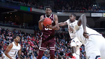 HIGHLAND HEIGHTS, KY - DECEMBER 12: Aric Holman #35 of the Mississippi State Bulldogs and SEC basketball rebounds. Cincinnati won 65-50. (Photo by Joe Robbins/Getty Images)
