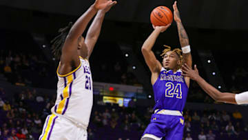 Nov 18, 2021; Baton Rouge, Louisiana, USA; McNeese State Cowboys forward Christian Shumate (24) shoots a jump shot against LSU Tigers forward Bradley Ezewiro (21) during the second half at Pete Maravich Assembly Center. Mandatory Credit: Stephen Lew-USA TODAY Sports