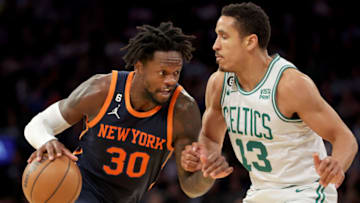Feb 27, 2023; New York, New York, USA; New York Knicks forward Julius Randle (30) drives to the basket against Boston Celtics guard Malcolm Brogdon (13) during the third quarter at Madison Square Garden. Mandatory Credit: Brad Penner-USA TODAY Sports