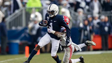 STATE COLLEGE, PA - NOVEMBER 30: KJ Hamler #1 of the Penn State Nittany Lions carries the ball as Christian Izien #12 of the Rutgers Scarlet Knights defends in the first half at Beaver Stadium on November 30, 2019 in State College, Pennsylvania. (Photo by Scott Taetsch/Getty Images)