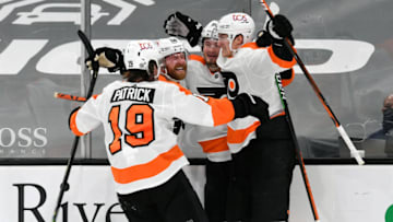 Apr 5, 2021; Boston, Massachusetts, USA; Philadelphia Flyers defenseman Travis Sanheim (6) celebrates with his teammates after scoring against the Boston Bruins during an overtime period at the TD Garden. Mandatory Credit: Brian Fluharty-USA TODAY Sports