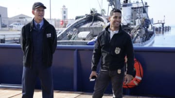 “All Hands” – After a civilian research vessel in the North Atlantic picks up a small boat of wounded Navy officers, NCIS arrives on the ship and is forced to hide after discovering terrorists on-board. Also, Agent Knight takes a paper doll along on the mission to capture photos for her niece’s grade school class, on the CBS Original series NCIS, Monday, Jan. 17 (9:00-10:00 PM, ET/PT) on the CBS Television Network and available to stream live and on demand on Paramount+* Pictured: Brian Dietzen as Jimmy Palmer and Wilmer Valderrama as Special Agent Nicholas “Nick” Torres. Photo: Cliff Lipson/CBS ©2021 CBS Broadcasting, Inc. All Rights Reserved.