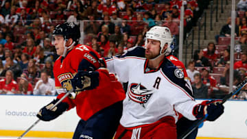 SUNRISE, FL - JANUARY 14: Brandon Dubinsky #17 of the Columbus Blue Jackets tangles with Mark Pysyk #13 of the Florida Panthers in front of the net at the BB&T Center on January 14, 2017 in Sunrise, Florida. (Photo by Eliot J. Schechter/NHLI via Getty Images)