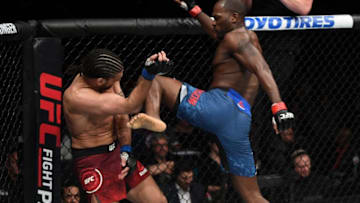 OTTAWA, ON - MAY 04: (R-L) Derek Brunson knees Elias Theodorou of Canada in their middleweight bout during the UFC Fight Night event at Canadian Tire Centre on May 4, 2019 in Ottawa, Ontario, Canada. (Photo by Jeff Bottari/Zuffa LLC/Zuffa LLC via Getty Images)
