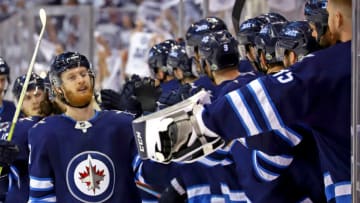 WINNIPEG, MB - MAY 14: Kyle Connor #81 of the Winnipeg Jets celebrates his third period goal against the Vegas Golden Knights with teammates at the bench in Game Two of the Western Conference Final during the 2018 NHL Stanley Cup Playoffs at the Bell MTS Place on May 14, 2018 in Winnipeg, Manitoba, Canada. (Photo by Darcy Finley/NHLI via Getty Images)