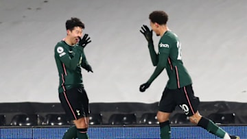 LONDON, ENGLAND - MARCH 04: Dele Alli of Tottenham Hotspur celebrates with teammate Son Heung-Min after scoring his team's first goal during the Premier League match between Fulham and Tottenham Hotspur at Craven Cottage on March 04, 2021 in London, England. Sporting stadiums around the UK remain under strict restrictions due to the Coronavirus Pandemic as Government social distancing laws prohibit fans inside venues resulting in games being played behind closed doors. (Photo by Clive Rose/Getty Images)