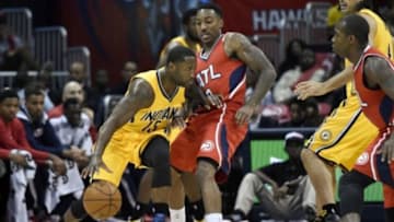 Nov 1, 2014; Atlanta, GA, USA; Indiana Pacers guard Donald Sloan (15) drives against Atlanta Hawks guard Jeff Teague (0) during the first half at Philips Arena. Mandatory Credit: Dale Zanine-USA TODAY Sports