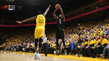 OAKLAND, CA - APRIL 15: JaMychal Green #4 of the LA Clippers shoots a three-pointer against the Golden State Warriors during Game Two of Round One of the 2019 NBA Playoffs on April 15, 2019 at ORACLE Arena in Oakland, California. NOTE TO USER: User expressly acknowledges and agrees that, by downloading and or using this photograph, user is consenting to the terms and conditions of Getty Images License Agreement. Mandatory Copyright Notice: Copyright 2019 NBAE (Photo by Noah Graham/NBAE via Getty Images)