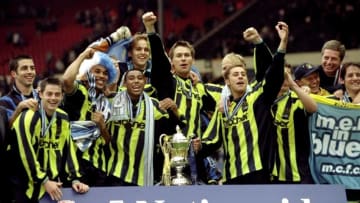 30 May 1999: Manchester City players celebrate promotion and victory after the Nationwide Division Two Play-Off Final match against Gillingham played at Wembley Stadium in London, England. The match finished in a 2-2 draw after extra-time and in the penalty shoot-out Manchester City won 3-1 and were promoted to Division One. Mandatory Credit: Alex Livesey /Allsport