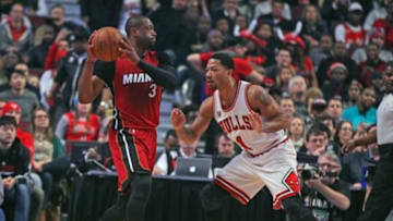 Jan 25, 2016; Chicago, IL, USA; Miami Heat guard Dwyane Wade (3) is defended by Chicago Bulls guard Derrick Rose (1) during the first quarter at the United Center. Mandatory Credit: Dennis Wierzbicki-USA TODAY Sports