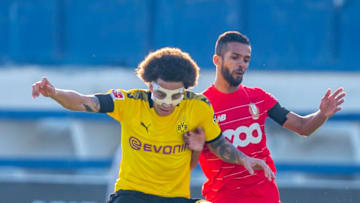 07 January 2020, Spain, Marbella/Provinz Malaga: Football: Test matches, Borussia Dortmund - Standard Liege at the Estadio Marbella. Dortmund's Axel Witsel (l) and Liège's Mehdi Carcela-Gonzalez fight for the ball. Photo: David Inderlied/dpa (Photo by David Inderlied/picture alliance via Getty Images)