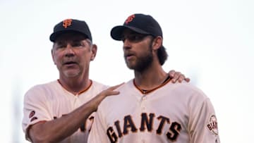 Jul 10, 2016; San Francisco, CA, USA; San Francisco Giants manager Bruce Bochy (15) celebrates with starting pitcher Madison Bumgarner (40) on the chest after his one hit shut out complete game against the Arizona Diamondbacks at AT&T Park. The San Francisco Giants defeated the Arizona Diamondbacks 4-0. Mandatory Credit: Kelley L Cox-USA TODAY Sports