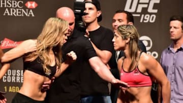 Jul 31, 2015; Rio de Janeiro, RJ, Brazil; Ronda Rousey (left) and Bethe Correia (right) face off during weigh-ins for UFC 190 at HSBC Arena. Mandatory Credit: Jason Silva-USA TODAY Sports