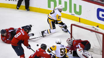 WASHINGTON, DC - APRIL 29: Washington Capitals goaltender Braden Holtby (70) makes a third period save on shot deflected by left wing Alex Ovechkin (8) made on pass from Pittsburgh Penguins right wing Bryan Rust (17) to defenseman Kris Letang (58) on April 29, 2018, at the Capital One Arena in Washington, D.C. in the Second Round of the Stanley Cup Playoffs. The Washington Capitals defeated the Pittsburgh Penguins, 4-1. (Photo by Mark Goldman/Icon Sportswire via Getty Images)