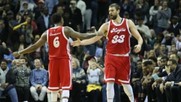 Dec 29, 2015; Memphis, TN, USA; Memphis Grizzlies center Marc Gasol (33) celebrates with guard Mario Chalmers (33) against the Miami Heat at FedExForum. The Grizzlies won 99-90 in overtime. Mandatory Credit: Nelson Chenault-USA TODAY Sports