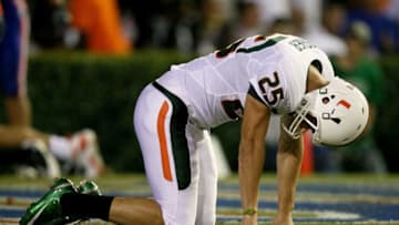 GAINESVILLE, FL - SEPTEMBER 06: Punter Matt Bosher #25 of the Miami Hurricanes reacts after having his punt blocked late in the first half resulting in a safety for the Florida Gators at Ben Hill Griffin Stadium on September 6, 2008 in Gainesville, Florida. (Photo by Doug Benc/Getty Images)
