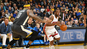 OAKLAND, CA - FEBRUARY 10: Dion Waiters #11 of the Miami Heat handles the ball during the game against DeMarcus Cousins #0 of the Golden State Warriors on February 10 at ORACLE Arena in Oakland, California. NOTE TO USER: User expressly acknowledges and agrees that, by downloading and or using this photograph, user is consenting to the terms and conditions of Getty Images License Agreement. Mandatory Copyright Notice: Copyright 2019 NBAE (Photo by Noah Graham/NBAE via Getty Images)