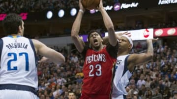 Jan 2, 2016; Dallas, TX, USA; New Orleans Pelicans forward Anthony Davis (23) drives to the basket between Dallas Mavericks center Zaza Pachulia (27) and forward Charlie Villanueva (3) during the second half at the American Airlines Center. The Mavericks defeat the Pelicans 105-98. Mandatory Credit: Jerome Miron-USA TODAY Sports