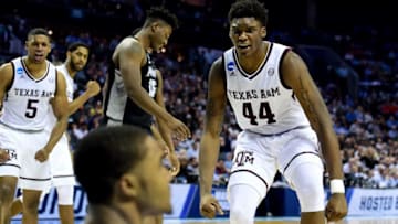 CHARLOTTE, NC - MARCH 16: Robert Williams #44 celebrates with teammate TJ Starks #2 of the Texas A&M Aggies after a dunk against the Providence Friars during the first round of the 2018 NCAA Men's Basketball Tournament at Spectrum Center on March 16, 2018 in Charlotte, North Carolina. (Photo by Jared C. Tilton/Getty Images)